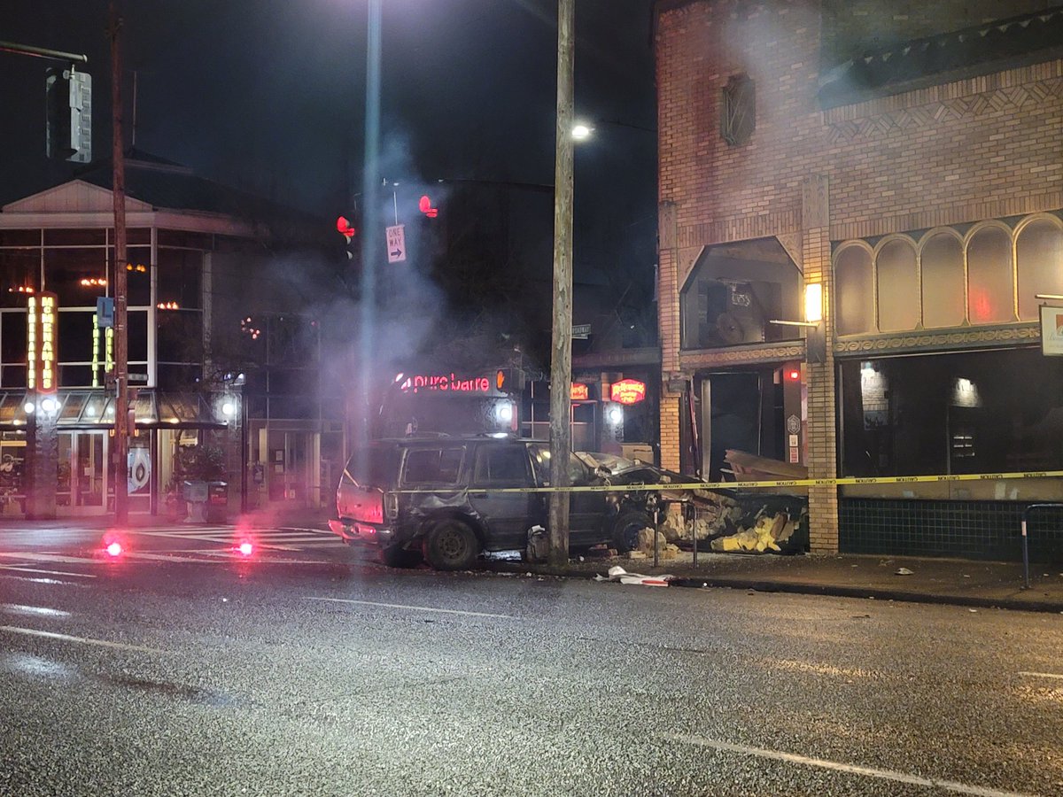 On NE 15th & Broadway a vehicle has crashed into the Bar name Capital &amp; destroyed some of the building. The brick built corner has crumbled on top of the car that crashed. Appears a 2nd car was involved. Tow trucks were on the scene