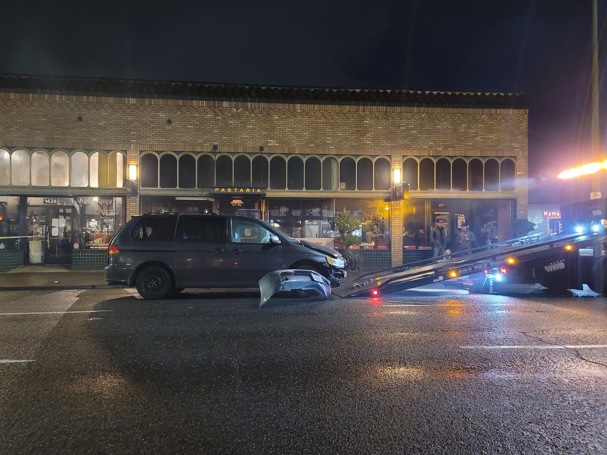 On NE 15th & Broadway a vehicle has crashed into the Bar name Capital &amp; destroyed some of the building. The brick built corner has crumbled on top of the car that crashed. Appears a 2nd car was involved. Tow trucks were on the scene