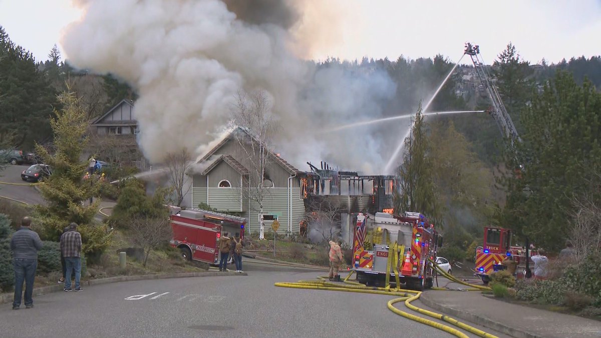 Portland Fire & Rescue is responding to two houses on fire near NW Burkhardt Ct. and Mill Pond Rd. in the Northwest Heights neighborhood close to the Beaverton/Portland boundary. KGW has a crew at the scene where flames and plumes of smoke are coming from one of the homes