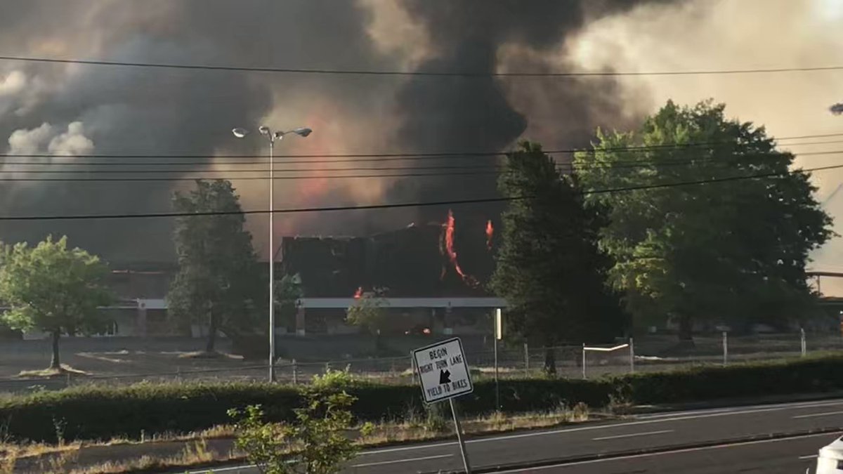 A large 3-alarm fire happening now near NE 120th and Sandy sending up  smoke plume.  Appears to be abandoned shopping complex.  Sandy Blvd CLOSED at NE 120th.  No word on cause or injuries.