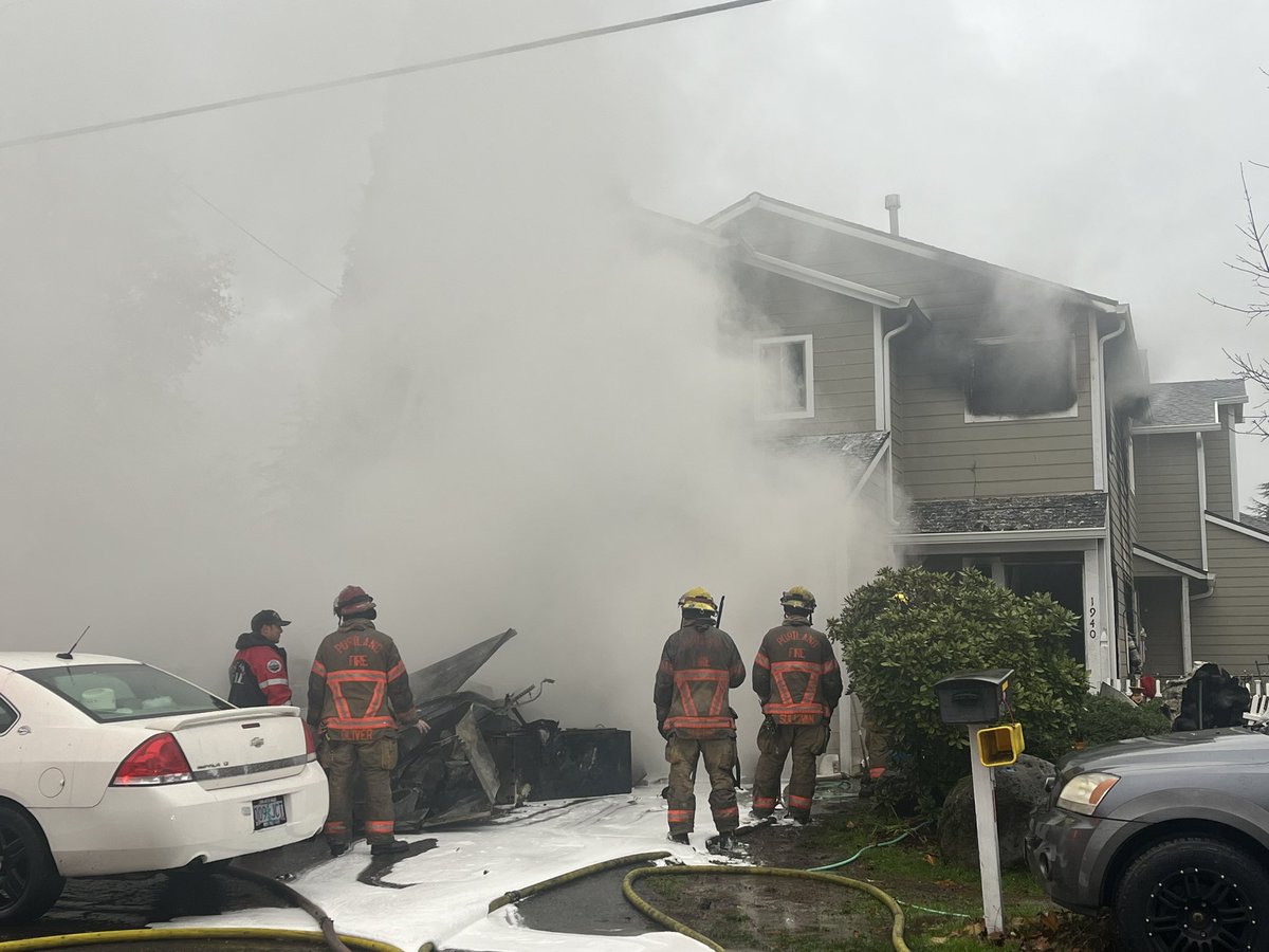 Scene of a 2-story duplex fire in SE Portland. 5 adults and 3 pets forced out but not hurt. Crews tell the fire likely started in garage and blew out windows. 